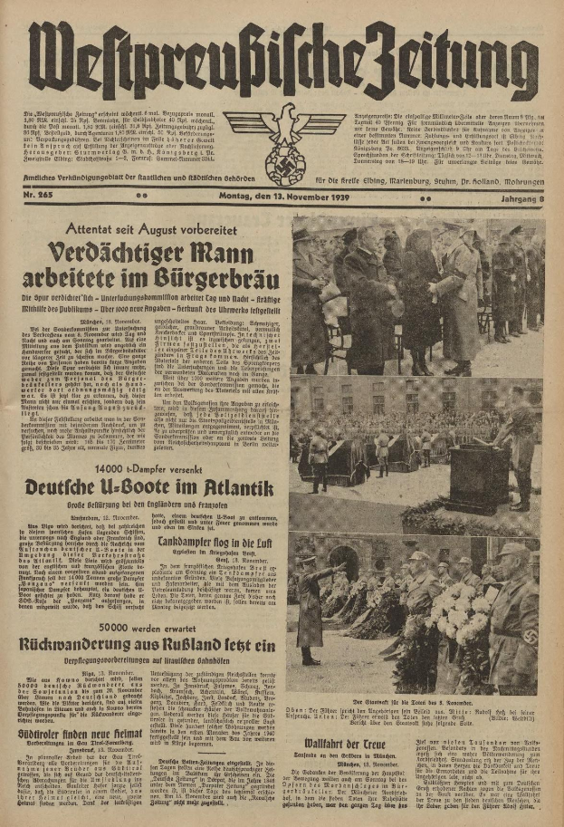 Schwarze-weiße Titelseite einer deutschen Zeitung vom 13. November 1939 mit derüberschrift 'Weitpreubliche Zeitung', die eine Gruppe von Menschen in traditioneller deutscher Kleidung auf einer Feier zeigt.