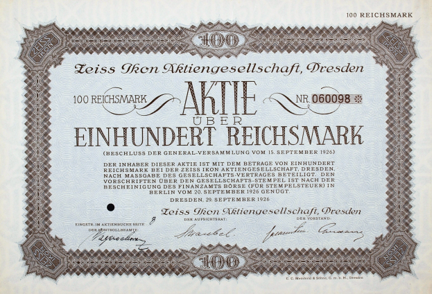 Altes deutsches Aktienzertifikat für 100 Reichsmark mit schwarzem Rand und gedrucktem Text.