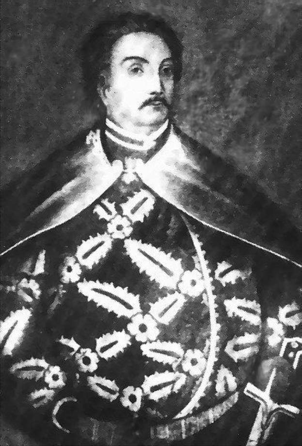 Schwarzes und weißes Foto von Papst Johannes Paul II. in Priestergewand, trägt eine schwarze Robe mit weißem Kragen und Manschetten, Hände gefaltet, strenger Ausdruck, direkter Blick.