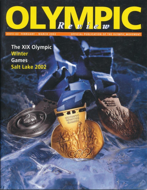Titelbild der *Olympischen Revue* mit mehreren Medaillen in verschiedenen Größen und Farben, mit fetter Schrift auf dem Cover.