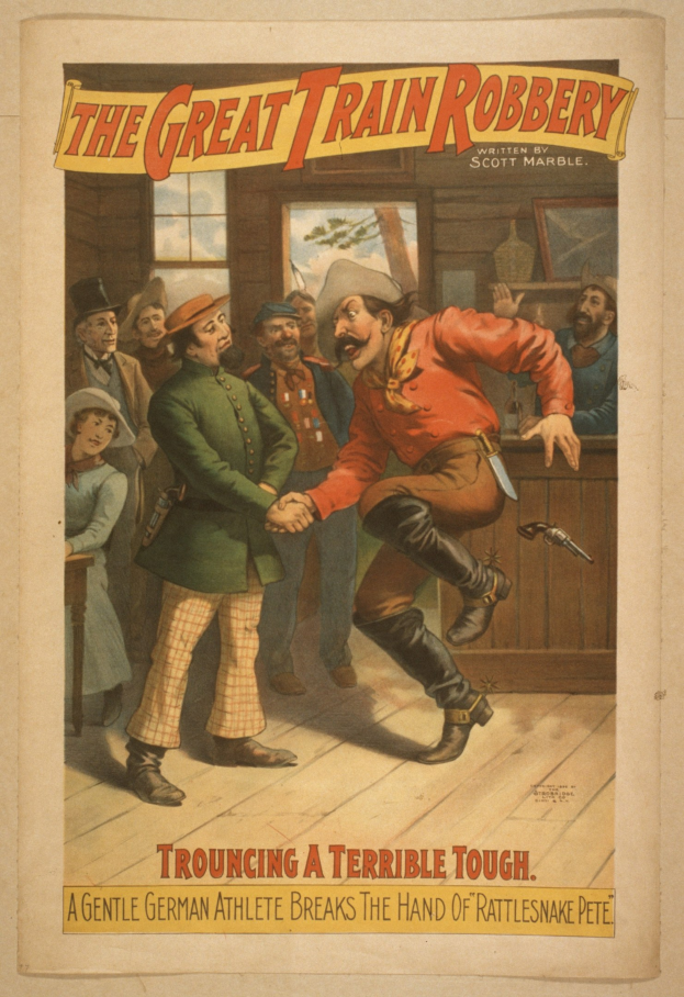 Plakat, das eine Gruppe von Menschen auf einem Boden zeigt, einer mit einer Waffe, mit einem Fenster und einer Wand im Hintergrund und dem Text "The Great Train Robbery - Trouching a Terrible Tough" oben und unten.